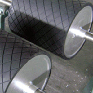 Re-rubberized grooved rollers